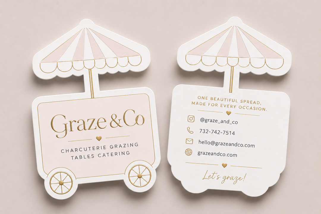 Graze & Co business cards with charcuterie cart design on a beige background