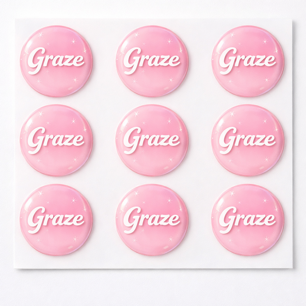 Pink buttons with 'Graze' text on a white background
